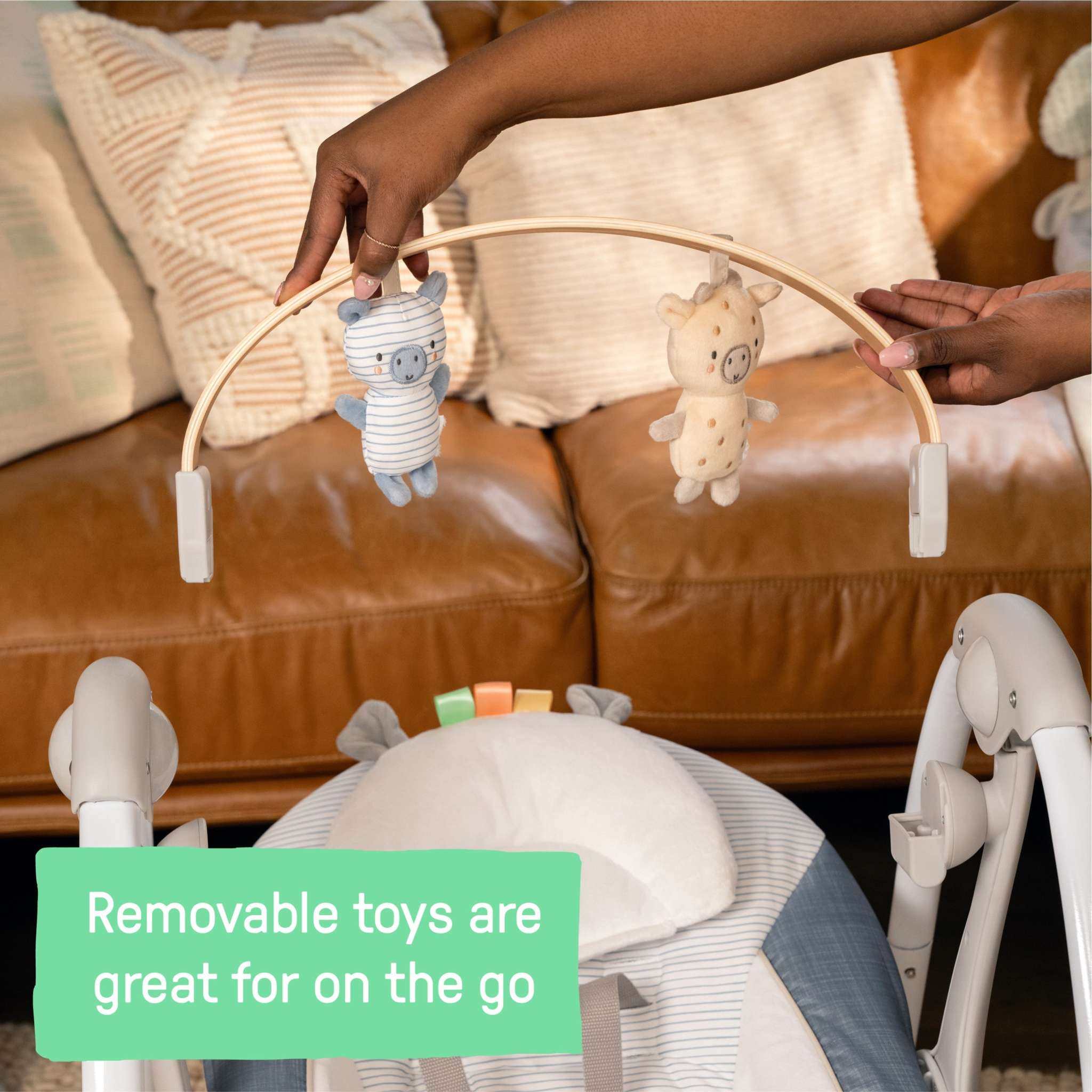 Ingenuity Swing ‘n Go portable baby swing in chambray with removable toy bar and plush seat