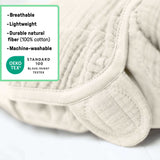 SwaddleMe by Ingenuity muslin baby swaddle in cream for 0-3 months with adjustable hook-and-loop closures