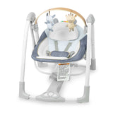 Ingenuity Swing ‘n Go portable baby swing with removable toy bar and plush seat in chambray color