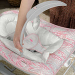 Ingenuity Keep Cozy 3-in-1 baby bouncer and rocker in pink with plush bunny toy