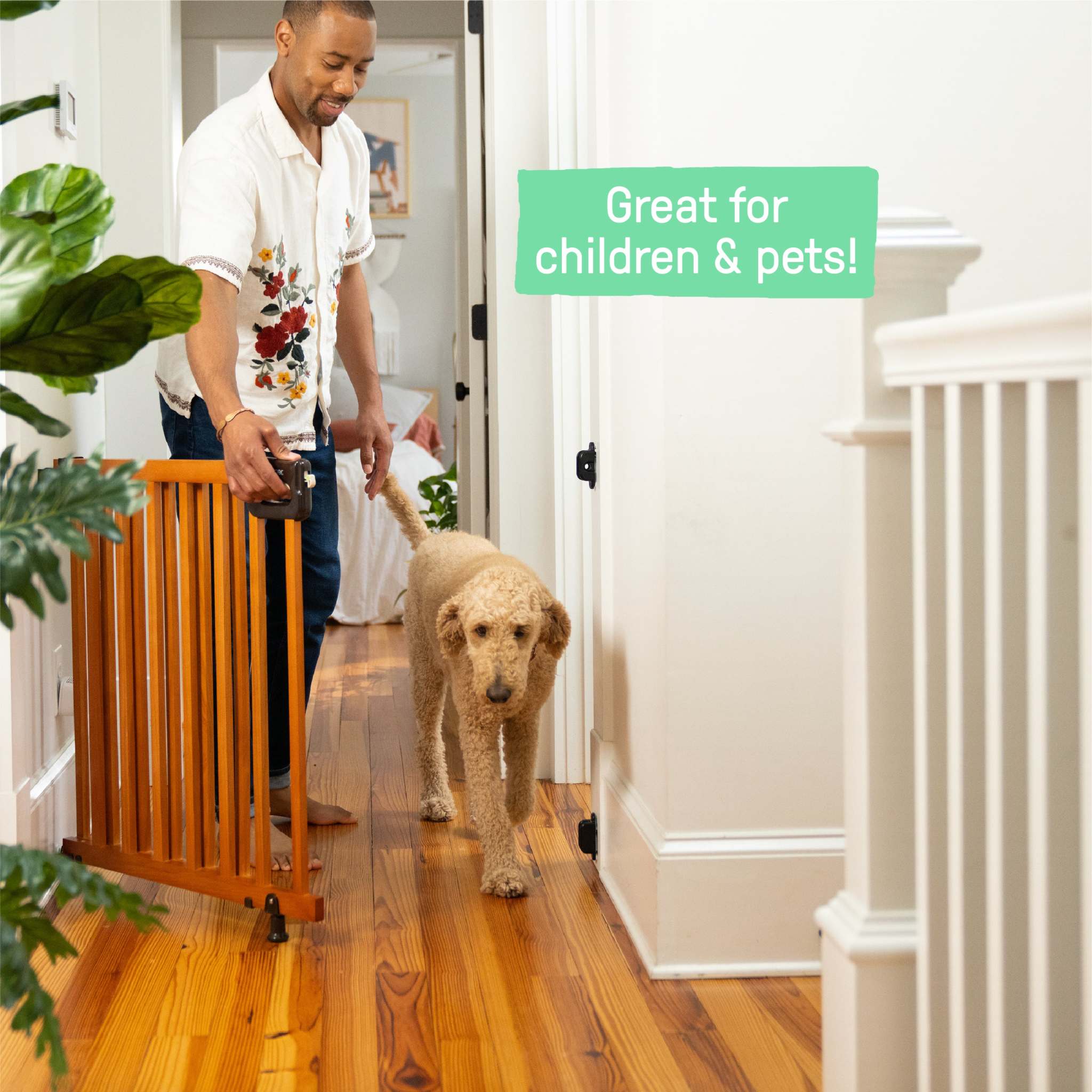 Ingenuity The Stairway 48W Series brown wood safety gate for stairs and hallways with locking indicator and comfort grip handle