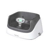 Ingenuity SmartClean toddler booster seat in slate color with removable foam insert and 3-point harness strapped to a dining chair