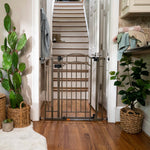Ingenuity The Doorway 48W Series bronze metal safety gate with arch and hold-open auto-close features for pets and babies