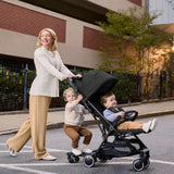 Ingenuity FoldAway Ride-On Board attached to stroller with removable seat for toddlers standing or seated riding