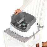 Ingenuity SmartClean Toddler Booster Seat in slate color with removable foam insert and 3-point harness for secure dining