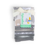 Folded baby blanket with elephant pattern and Ingenuity brand tag on a white background