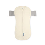 Cream-colored baby swaddle with gray straps on a white background