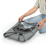 Stow & Go Compact Folding Bouncer lightweight fold-flat baby seat with calming Vibe-Pod and removable rattle toy