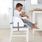 Ingenuity Baby Base 2-in-1 booster seat in Cashmere attached to dining chair with removable tray for babies and toddlers