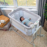 Ingenuity Dream Hero 3-in-1 co-sleeping bassinet in grey with breathable mesh sides and adjustable height