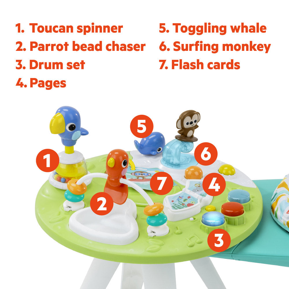 Children's activity table with various educational toys and labeled features on a white background.