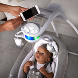 Ingenuity InLighten Baby Swing with breathable mesh fabric, vibrating seat, 180° rotation, light-up mobile with plush owl and lion toys