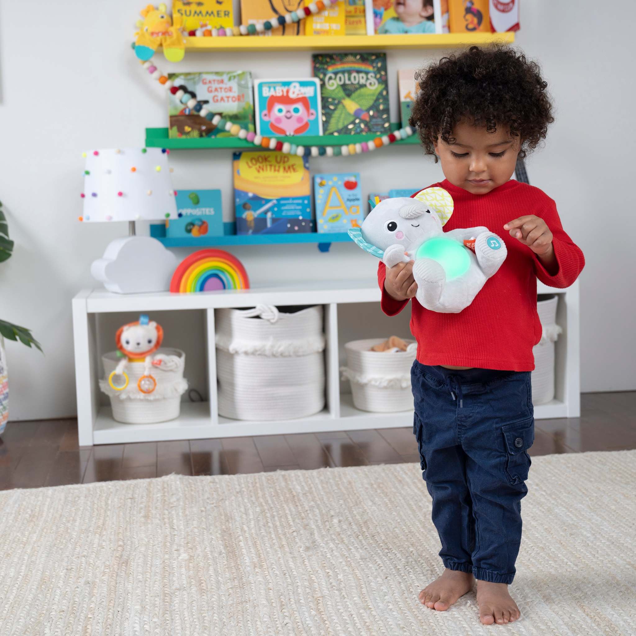 Hug-a-bye Baby soft elephant toy with musical lights and tactile features for infants