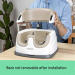 Ingenuity Baby Base 2-in-1 booster seat in cashmere attached to dining chair with removable tray and foam insert for baby and toddler use