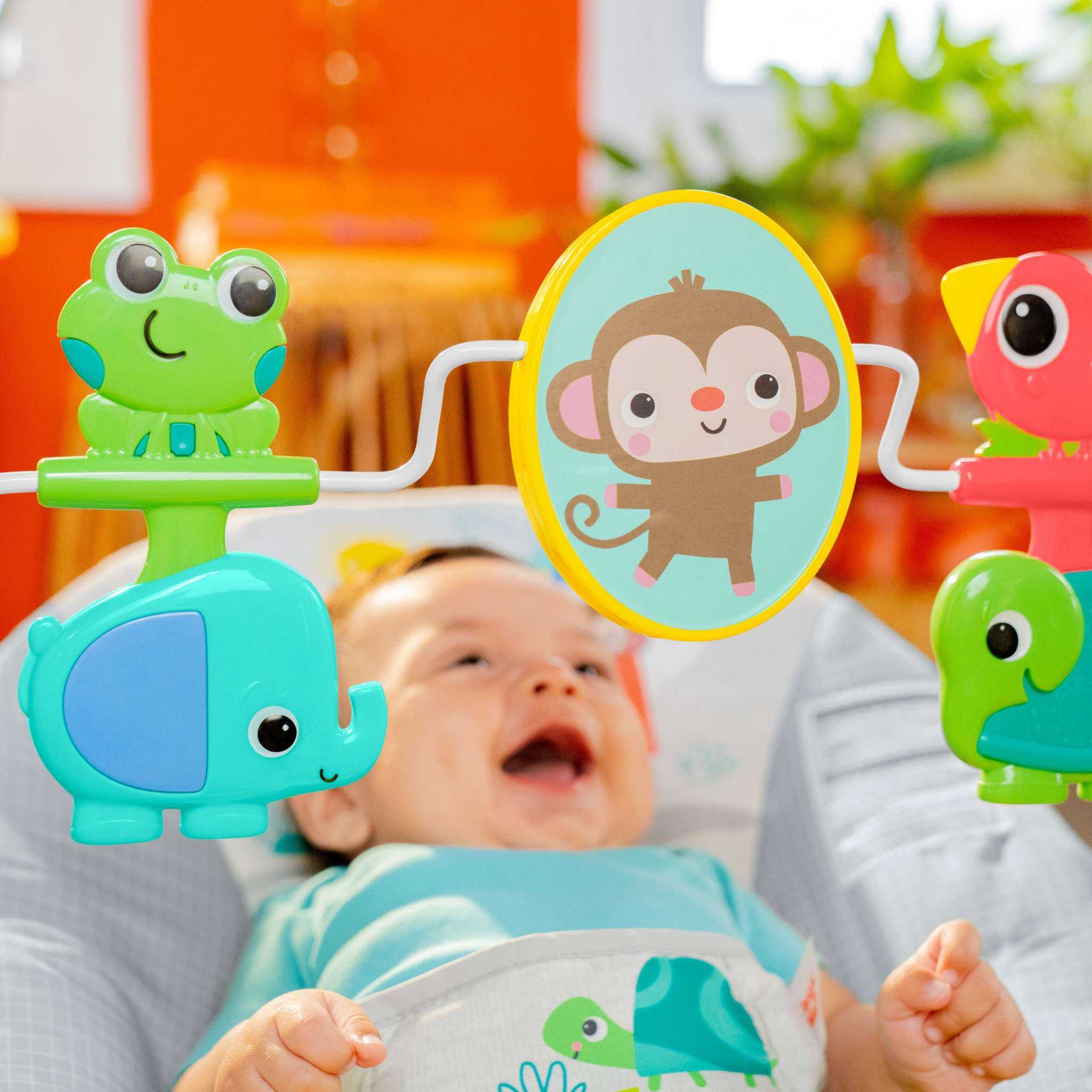 Bright Starts Playful Paradise vibrating baby bouncer with spinning toys and mirror